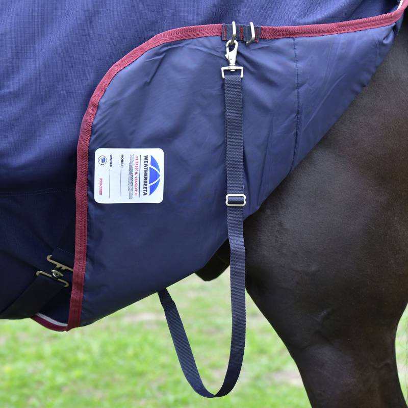 Close-up of Weatherbeeta Comfitec Essential 220g navy/burgundy turnout rug on a horse.