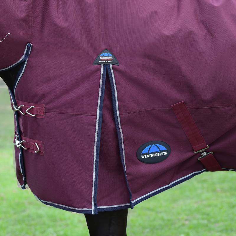 Close-up of a horse in a Weatherbeeta Comfitec Essential Combo Neck Rug 50g Burgundy/Navy.