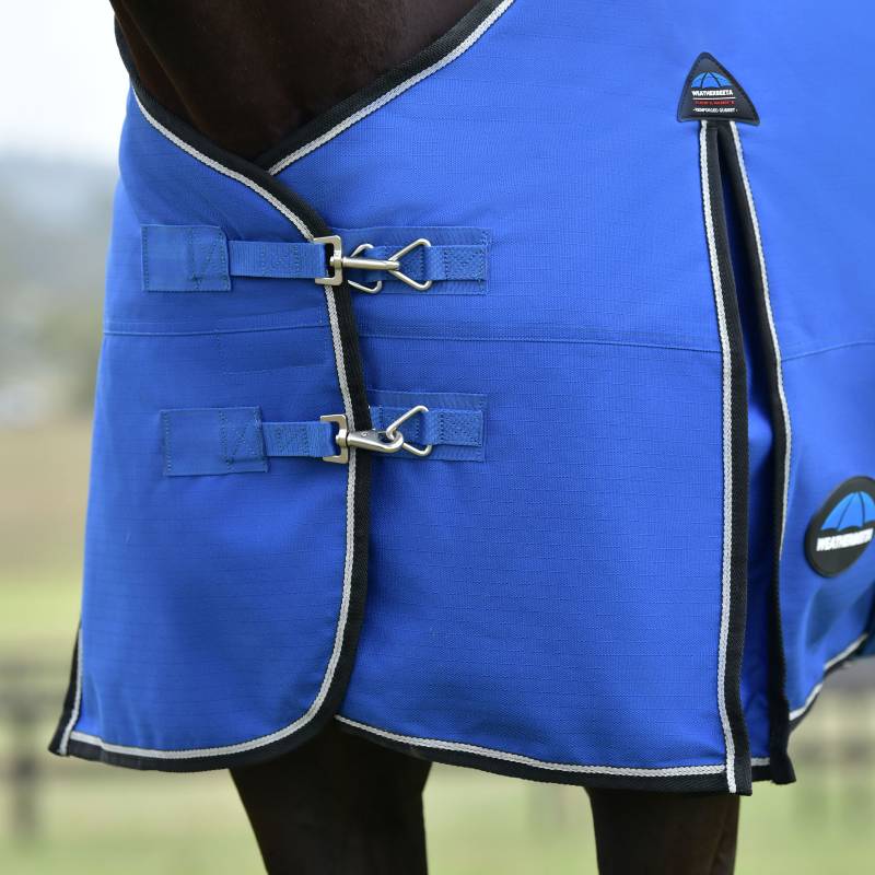 Weatherbeeta Comfitec Essential 220g rug in cobalt/black with buckles and trim on a horse.