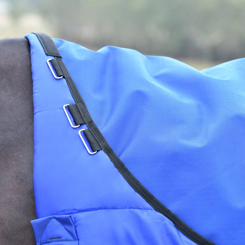 Close-up of a Weatherbeeta Comfitec Essential 220g Standard Neck Turnout Rug in cobalt/black.