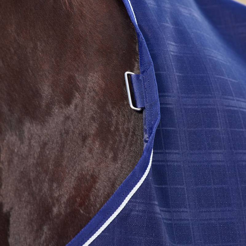 Close-up of a horse in a Weatherbeeta Comfitec Prelim 220g Navy Embossed Plaid Turnout Rug.