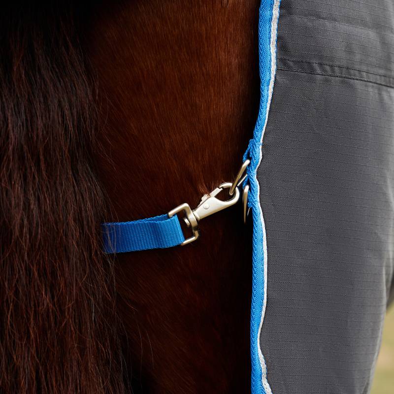 Close-up of a blue strap on a Weatherbeeta Comfitec Tyro Combo Neck Turnout Rug Black/Cobalt.