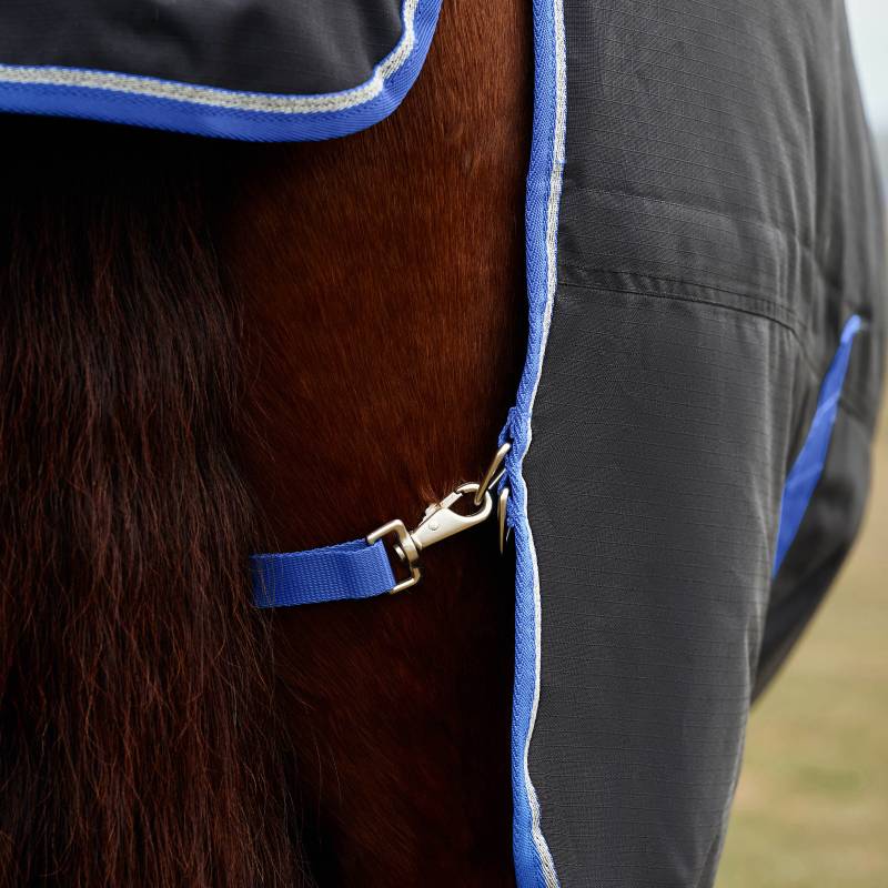 Close-up of a horse in a Weatherbeeta Comfitec Tyro Turnout Rug Standard Neck 220g Black/Cobalt.