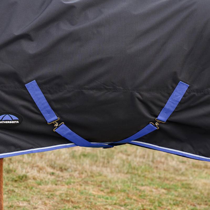 Close-up of Weatherbeeta Comfitec Tyro Turnout Rug 220g straps fastened around a horse’s belly.