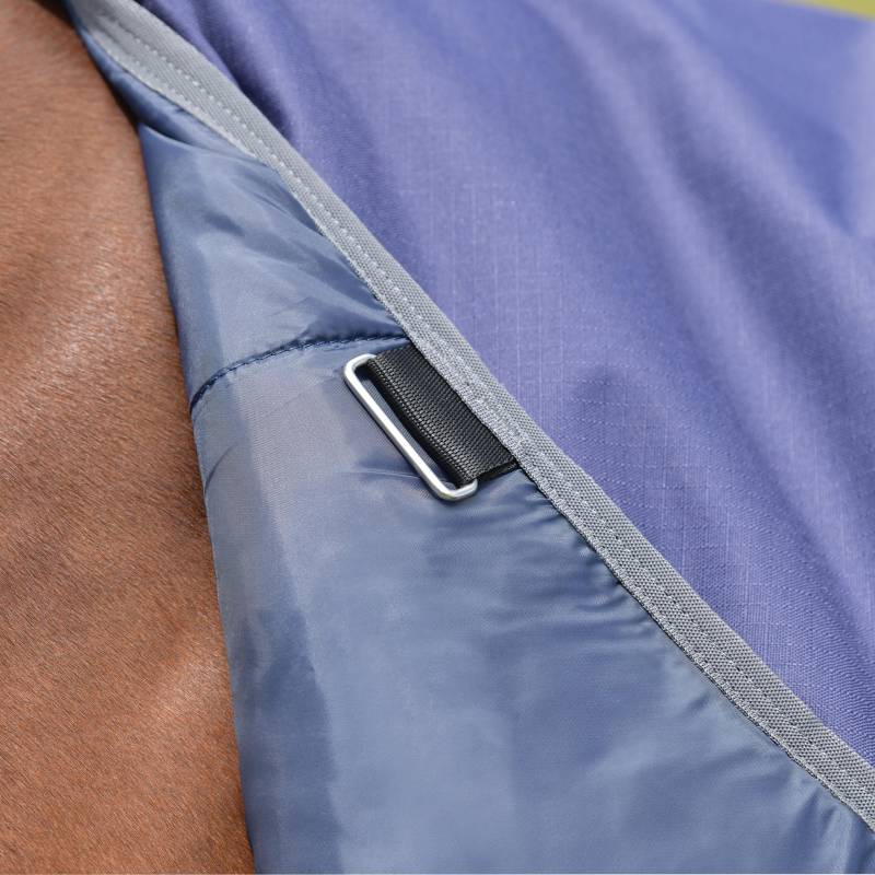 Navy Weatherbeeta Comfitec Tyro Turnout Rug 220g with strap and buckle on horse.