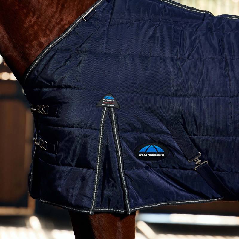 Close-up of a horse in a Weatherbeeta Comfitec PP Channel Quilt Stable Rug indoors.