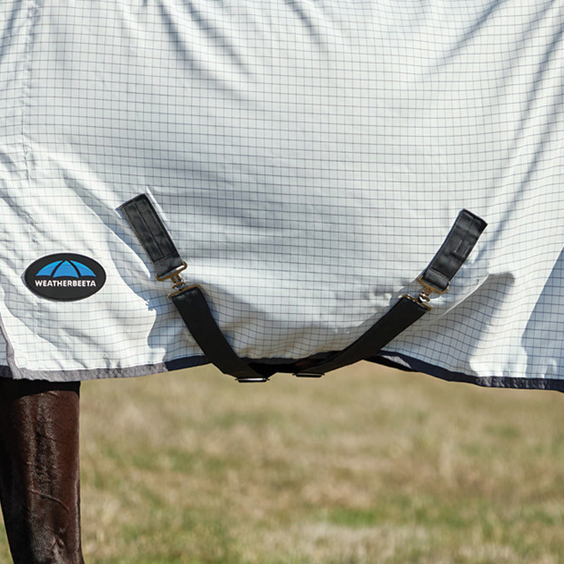 Close-up of a horse in a Weatherbeeta Hybrid Sheet Combo Neck Rug, white/charcoal with black straps.