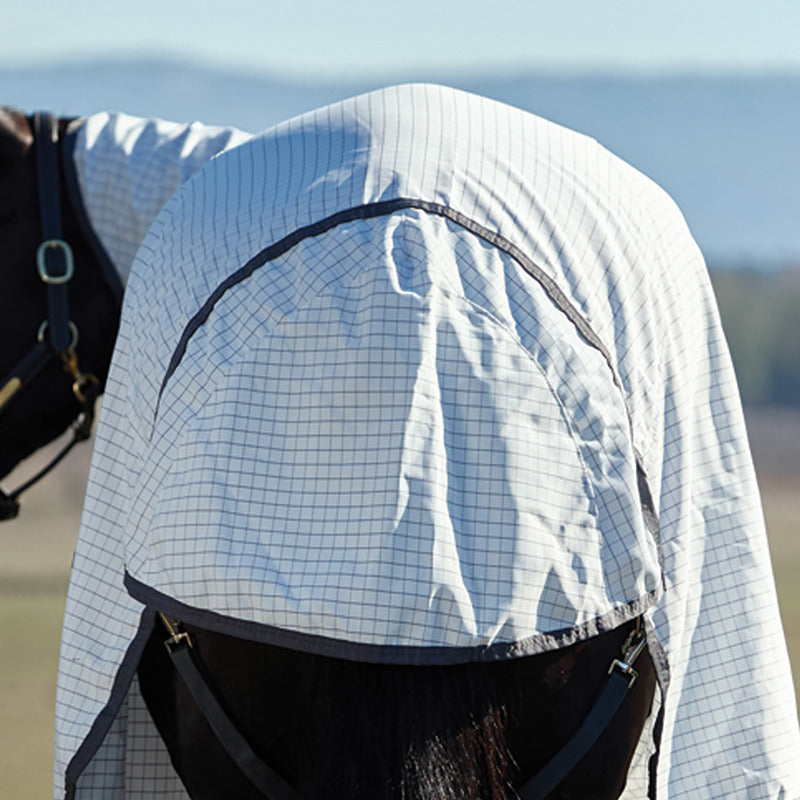 A horse wears the Weatherbeeta Hybrid Sheet Combo Neck Lightweight Rug, covering head and neck.