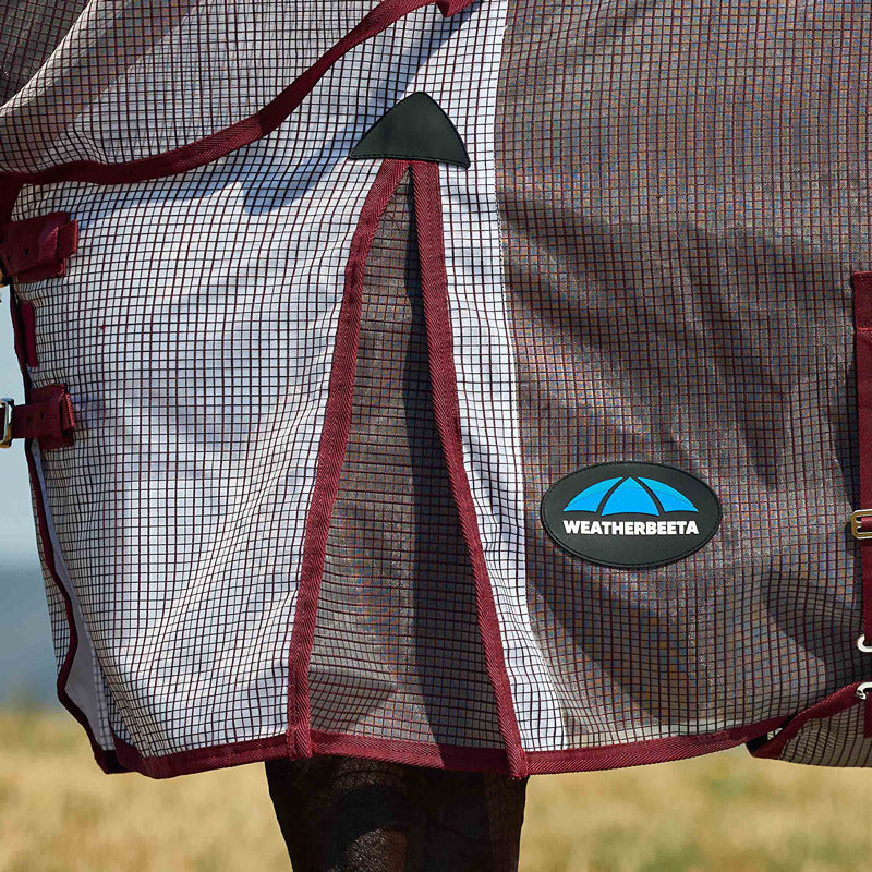 Close-up of a horse in a Weatherbeeta Comfitec Ripshield Fly Rug with logo on the mesh side.