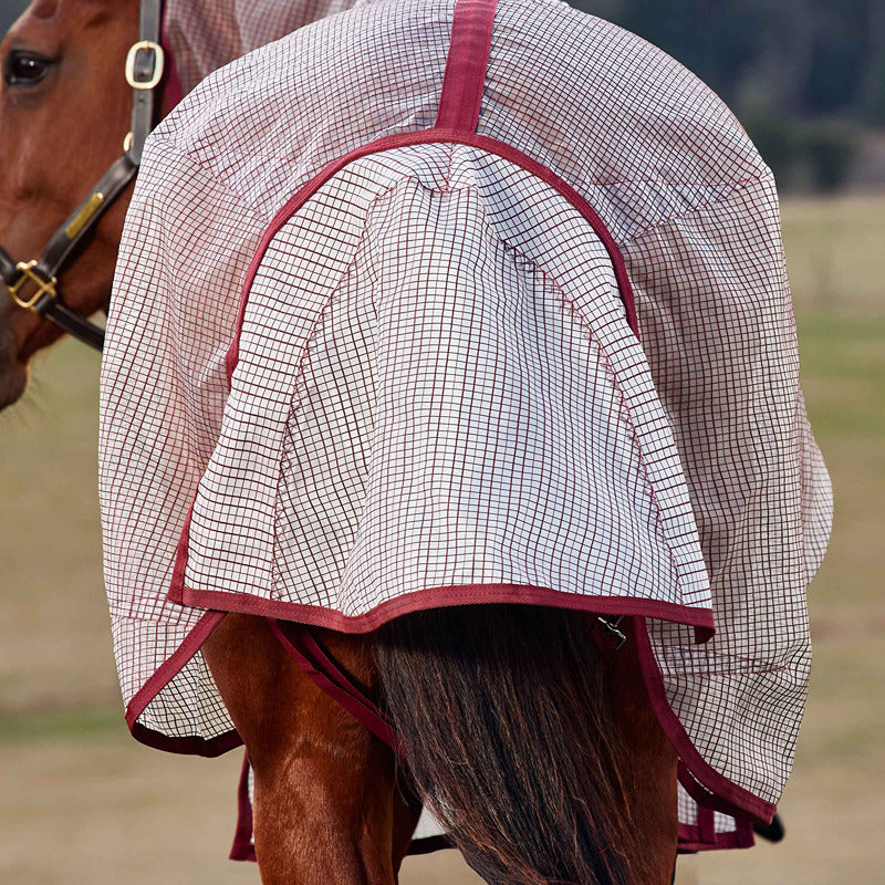 A horse in a Weatherbeeta Comfitec Ripshield Fly Rug covers its back and hindquarters.