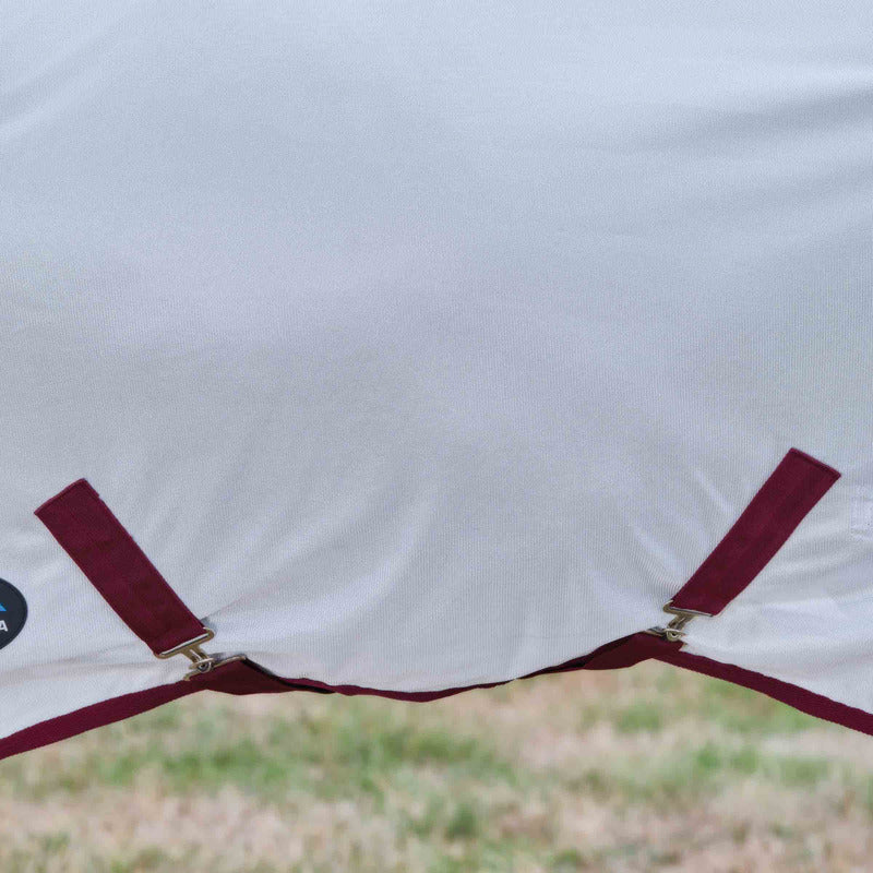 Close-up of Weatherbeeta Comfitec Combo Neck Fly Rug White/Burgundy on grass.