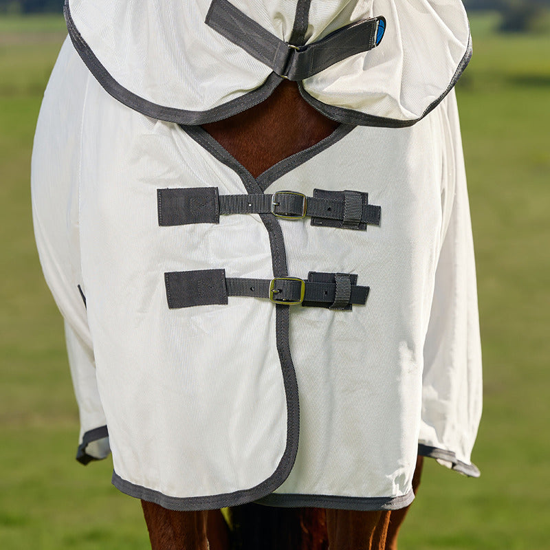 Close-up of a horse in a Weatherbeeta Comfitec Tyro Combo Neck Fly Rug, outdoors.