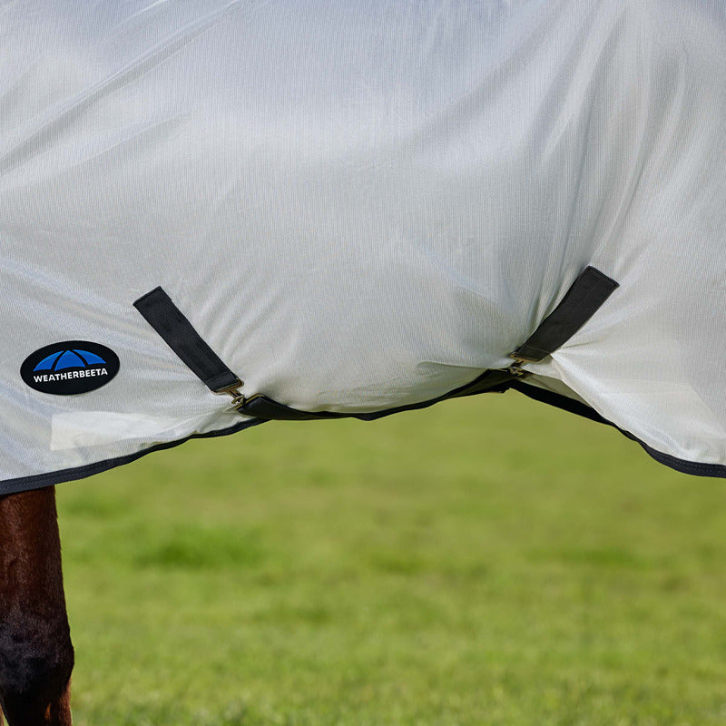 Weatherbeeta Comfitec Tyro Combo Neck Fly Rug White/Charcoal with UV protection on grass.