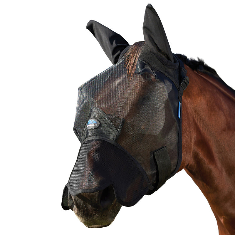 A brown horse outside wears a Weatherbeeta Comfitec Insect Guard Fly Mask With Ears & Nose.