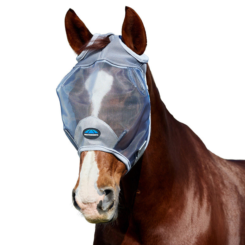 A horse wears the Weatherbeeta Comfitec Durable Mesh Fly Mask Grey for UV protection outdoors.