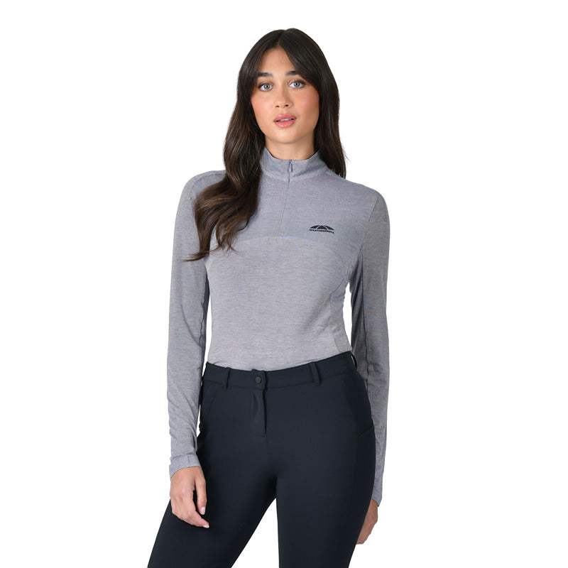 A woman wears a Weatherbeeta navy/mauve wine marle 1/4 zip top, standing by a white backdrop.