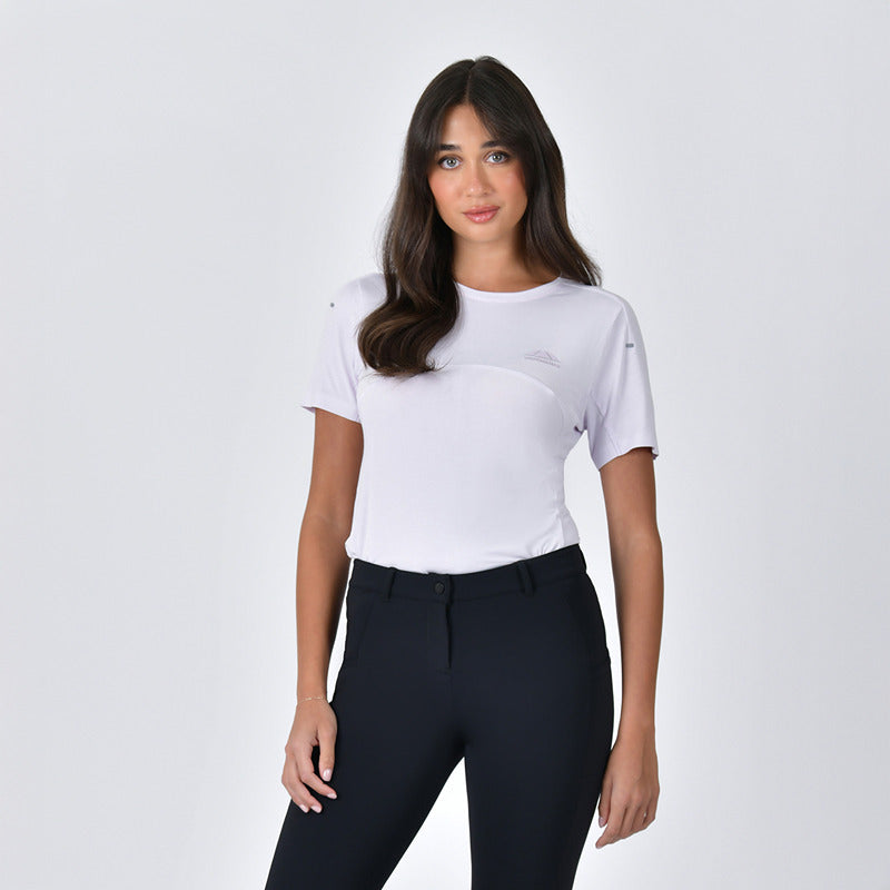 Woman wears Weatherbeeta 37.5 Lightweight Top in Lavender Mist Marle, paired with black pants.