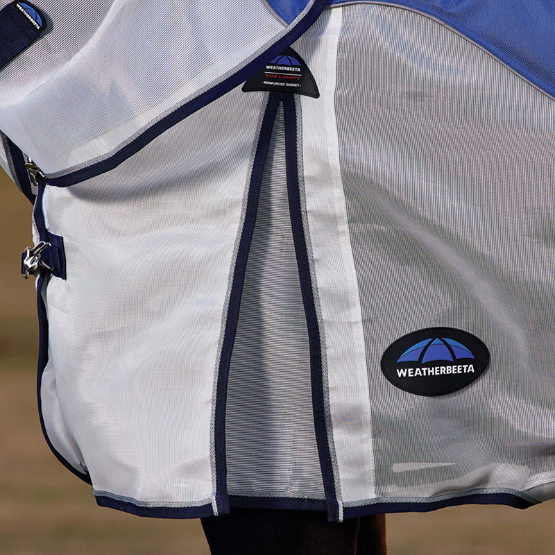 Horse outdoors wearing Weatherbeeta Comfitec Duo Shield Lightweight Fly Rug in Blue/Silver/Navy.