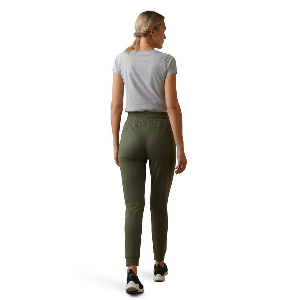 Woman in Ariat Memento Jogger Beetle, facing away, wearing a gray t-shirt.