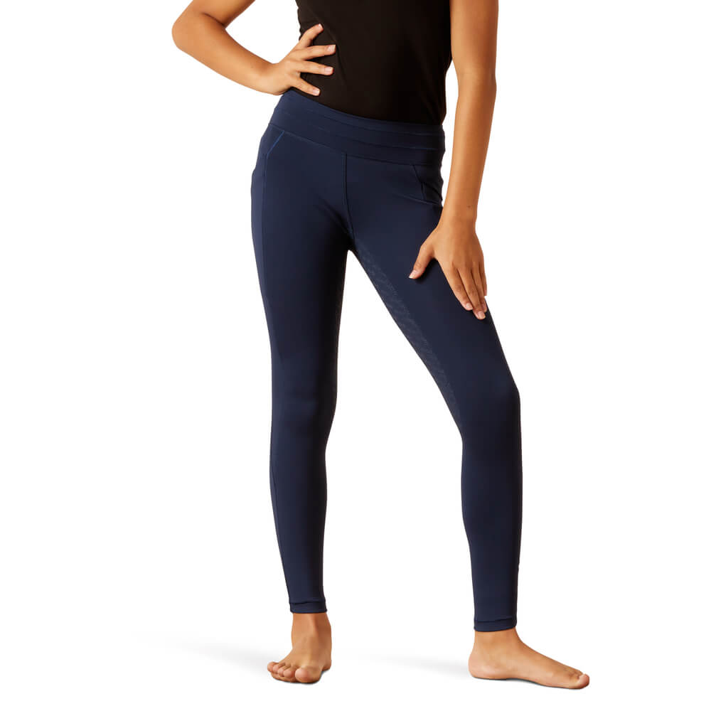 Youth wearing Ariat Eos 2.0 FS Tight Navy and black top, barefoot against a white background.