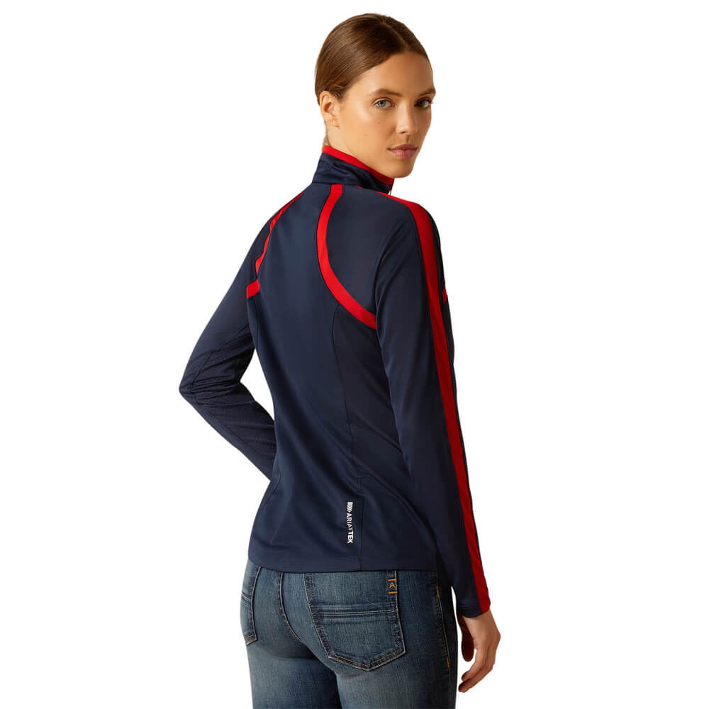 Woman in Ariat Womens Sunstopper 3.0 Baselayer Navy/Red and blue jeans, seen from behind.