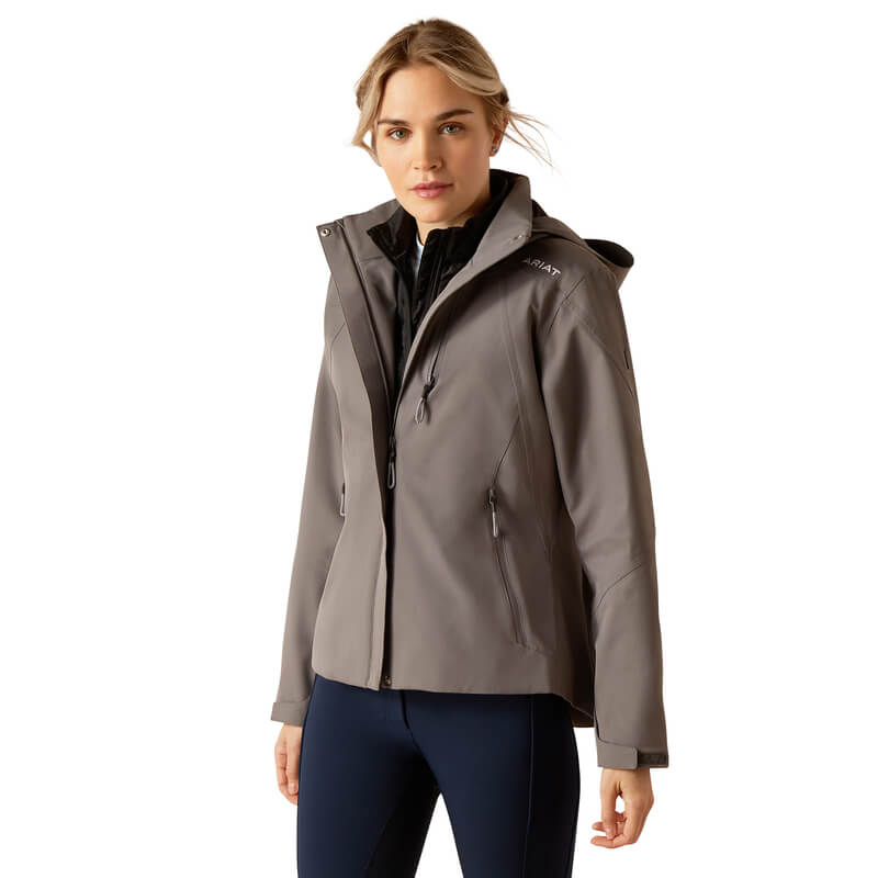 Woman wears Ariat Womens Coastal H2O Jacket Plum Grey with dark pants against white background.