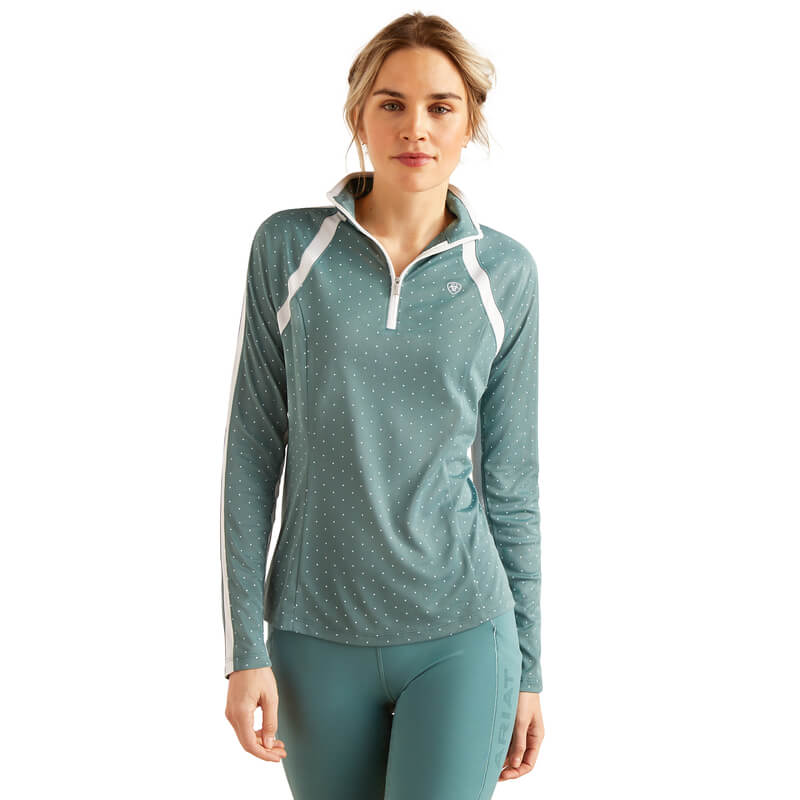 Woman in an Ariat Womens Sunstopper 3.0 Baselayer North Atlantic Dot and matching leggings.