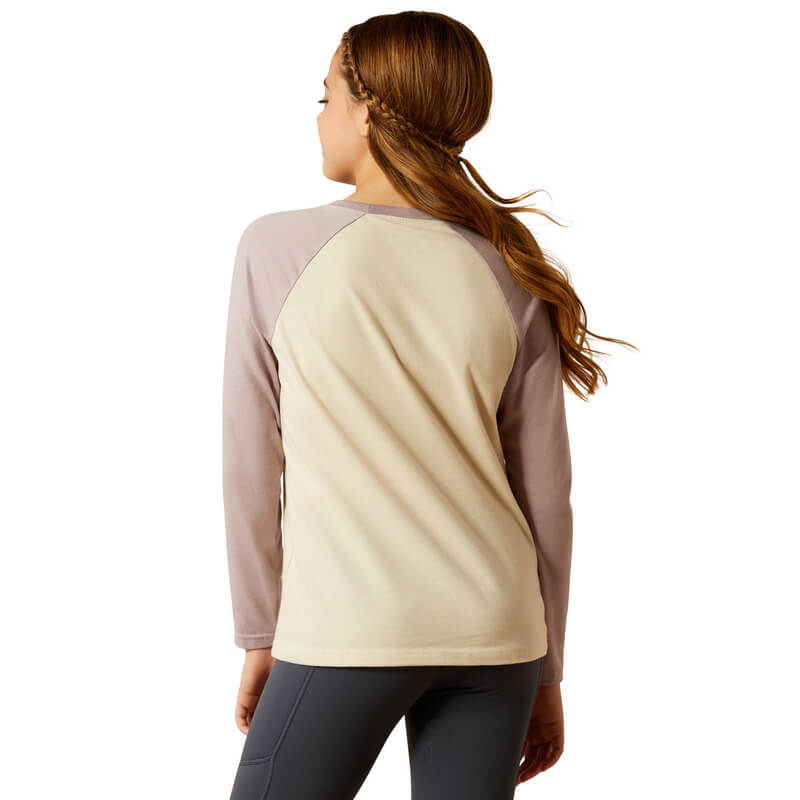 Girl with braided hair in an Ariat Youth Pony Script Baseball Top, natural, seen from behind.