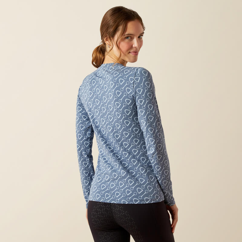 Woman smiling, facing back in Ariat China Blue Hardware Print Long Sleeve T-Shirt.