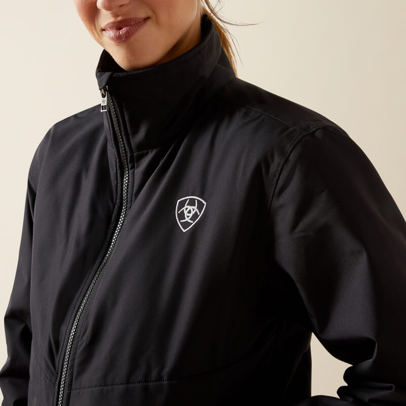 Woman in Ariat Womens Stable 2.0 Insulated Jacket Black with lightweight insulation.