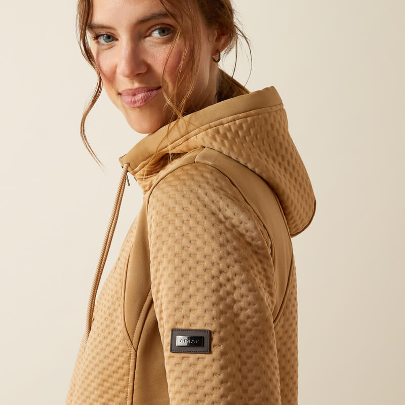 Woman in Ariat Womens Radiance Full Zip Tiger's Eye hoodie and black leggings.
