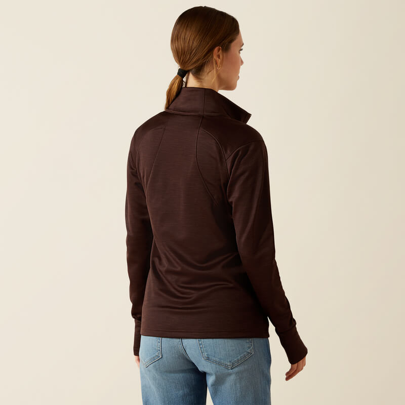 Woman in Ariat Womens Team EQ 1/2 Zip Pullover Java and jeans, facing away from the camera.