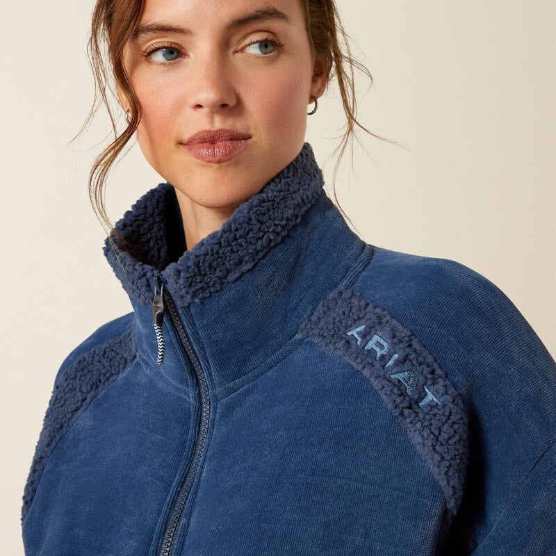 Woman in Ariat Lafayette Full Zip Fleece Big Dipper, smiling at the camera in jeans.