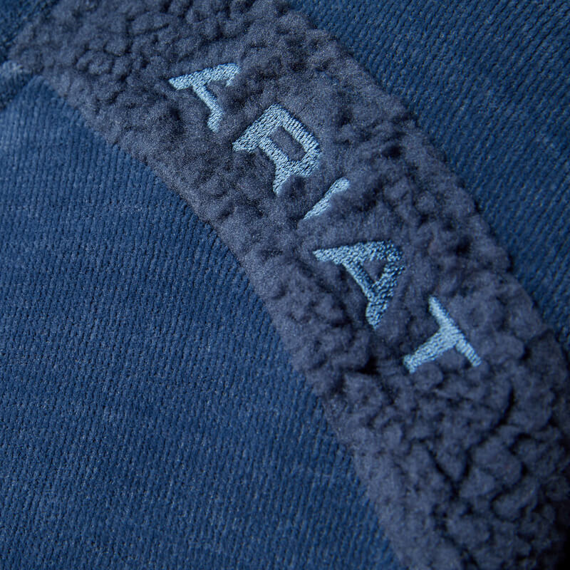 Close-up of Ariat Womens Lafayette Full Zip Fleece Big Dipper with ARIAT on blue strip.