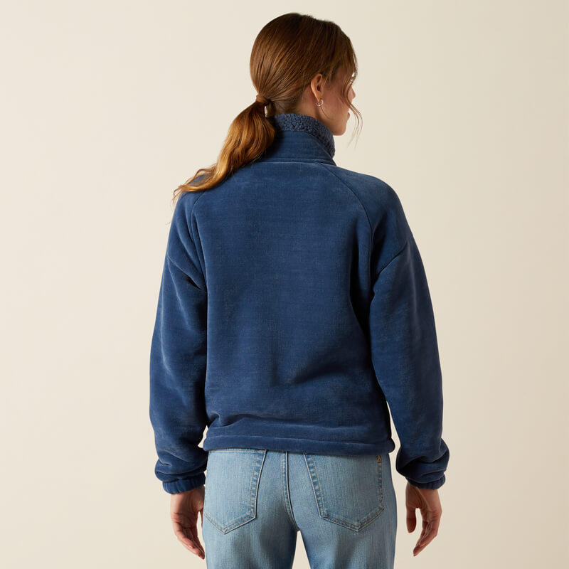 Woman in an Ariat Lafayette Full Zip Fleece Big Dipper jacket and jeans, facing away.