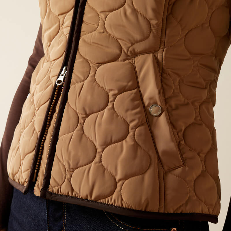 Close-up of Ariat Womens Ashley 2.0 Insulated Vest Tiger's Eye, styled over jeans.