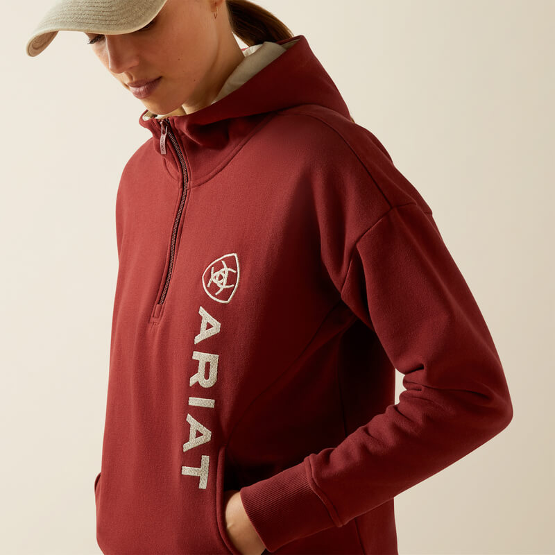 Wearing an Ariat Womens Rabere 2.0 Hoodie in Madder Brown, hands in pockets.