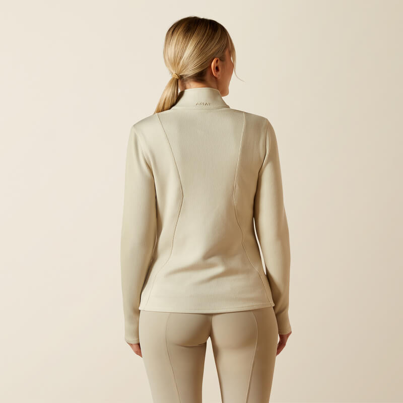 Woman in Ariat Womens Lucent 1/4 Zip Baselayer Pelican, back view, neutral background.