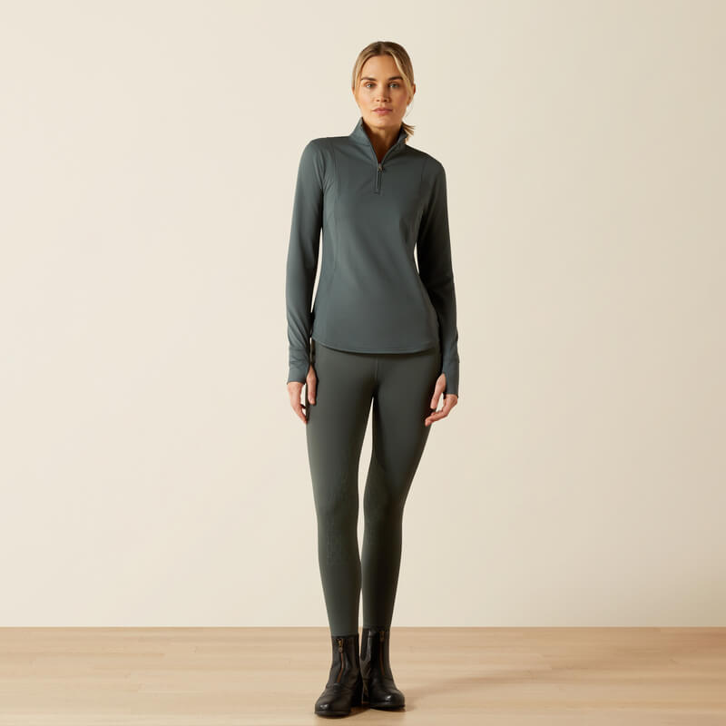 Woman in Ariat Gridwork 2.0 Baselayer Urban Chic stands against a plain, light background.