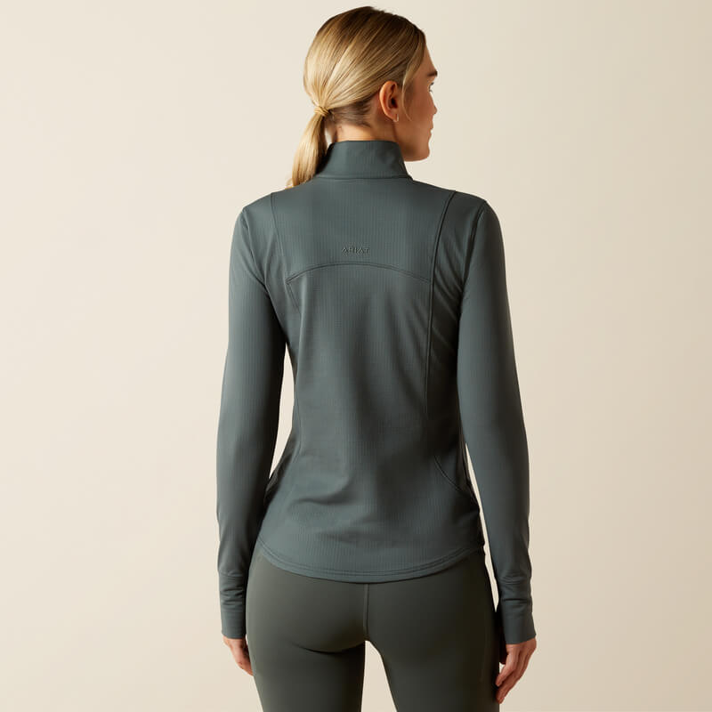 Woman wearing the Ariat Gridwork 2.0 1/4 Zip Baselayer in Urban Chic, seen from behind.