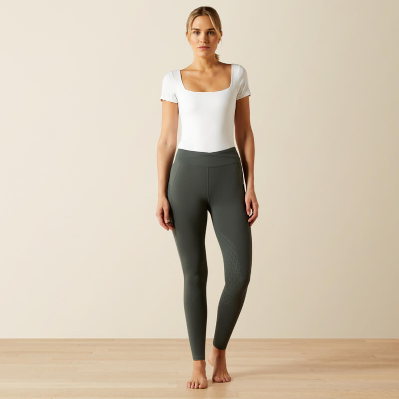 Woman in Ariat Womens Avail 2.0 Half Grip Tight Urban Chic stands barefoot on light wood floor.