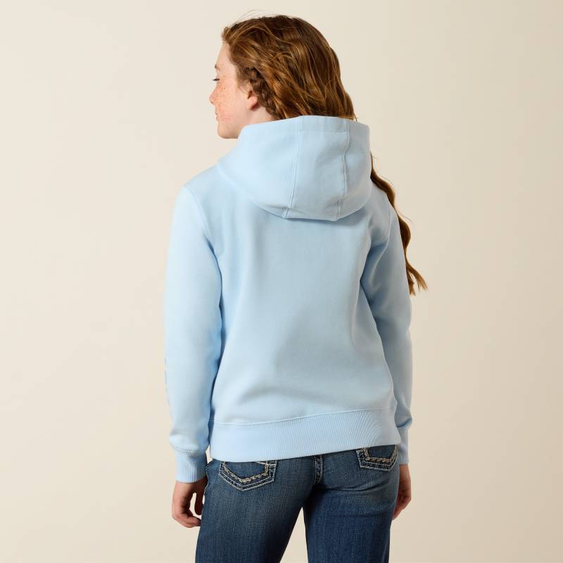 Girl in Ariat Girls 2.0 Hoodie Nantucket Breeze and jeans, shown from behind.