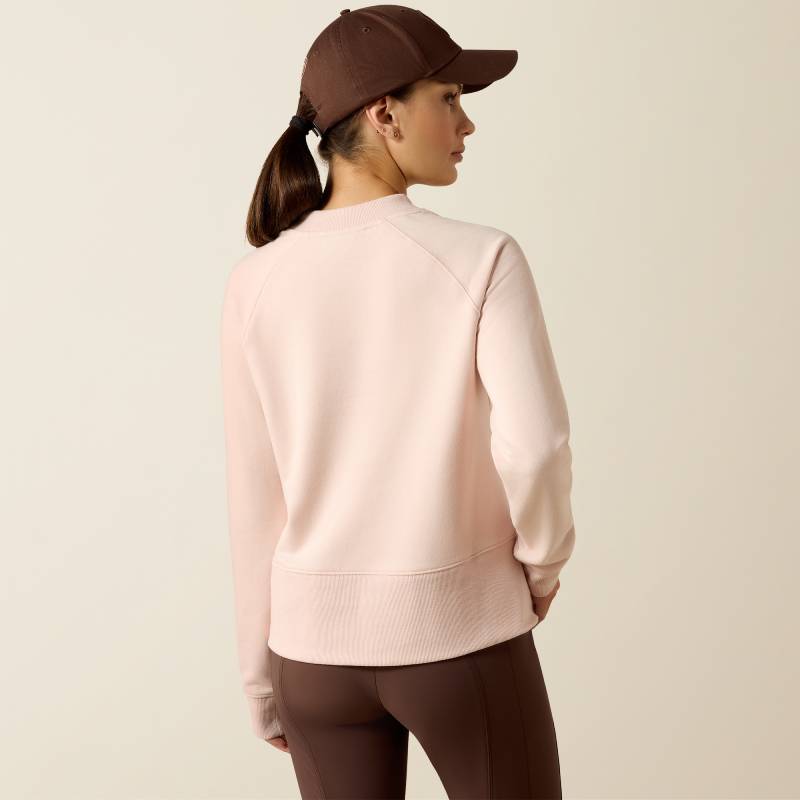 Woman in an Ariat Womens Martine Sweatshirt Sepia Rose faces away against a plain background.