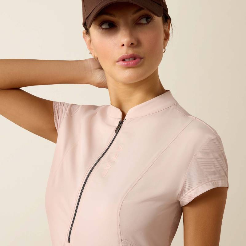 Woman wears Ariat Breathe 1/2 Zip Sepia Rose baselayer and brown leggings against plain background.