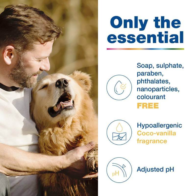 A man cuddles a happy dog with DOUXO S3 PYO, an antibacterial, hypoallergenic mousse for dogs.