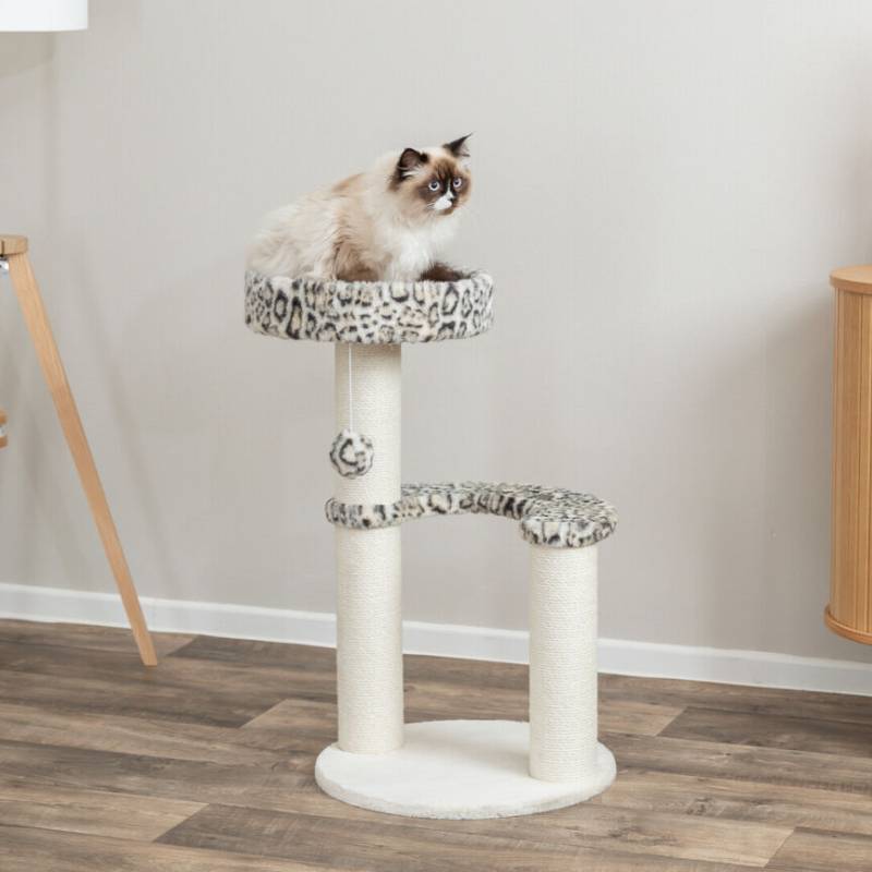 A fluffy cat lounges on the Trixie Leo Cat Tree Round Cream Leopard in a modern room.
