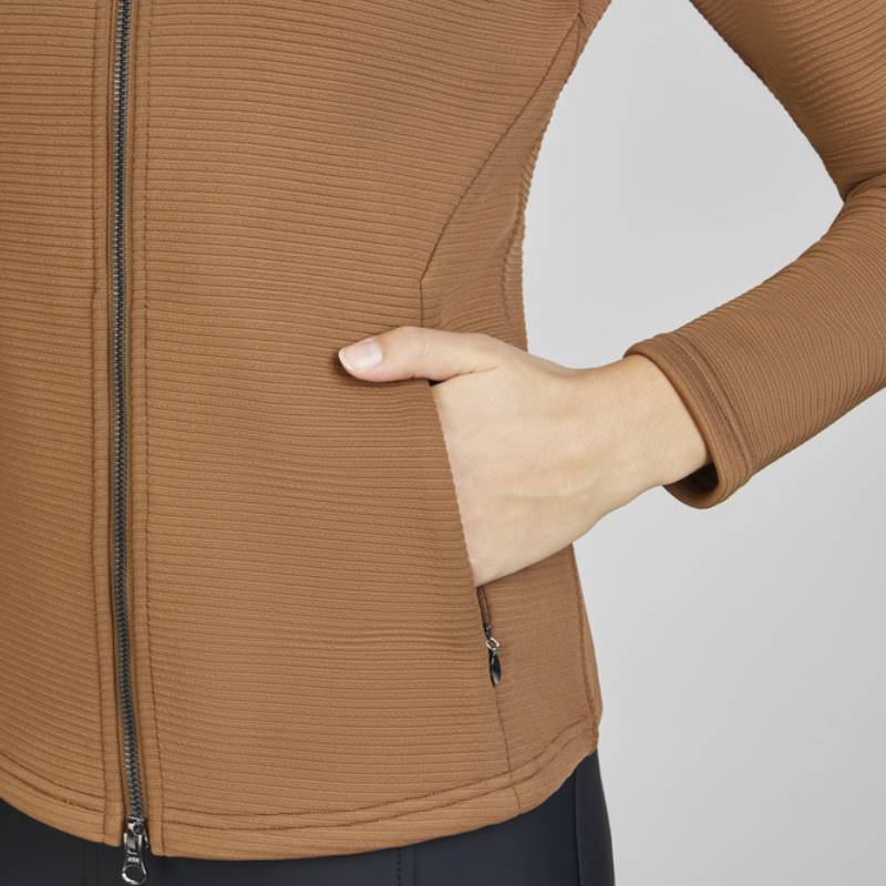 Hand in pocket of Eskadron Heritage Zip-Shirt Almond, with black pants visible.