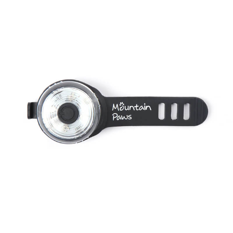 Mountain Paws Dog Safety Light with black strap on white background; water-resistant.