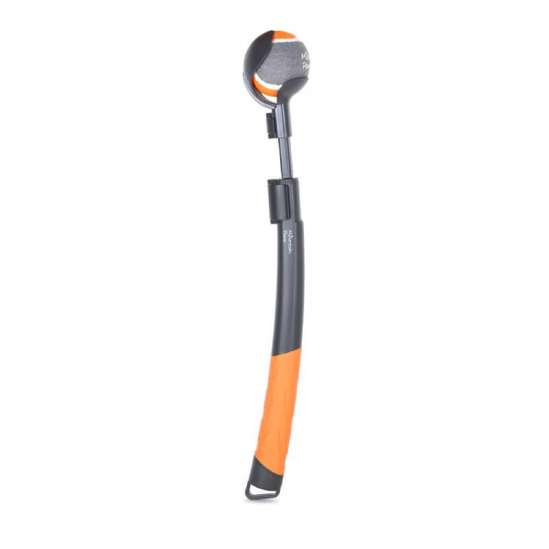 Mountain Paws Dog Ball Launcher Adjustable holds a tennis ball, with orange and black design.