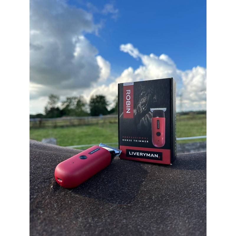 The Liveryman Robin Trimmer is a quiet, compact red and black electric animal trimmer.